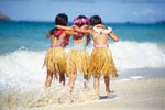 3 girls walking along a beach in Hawaii